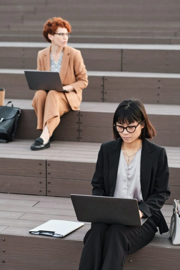 female office workers with laptops e1640423586764 683x1024